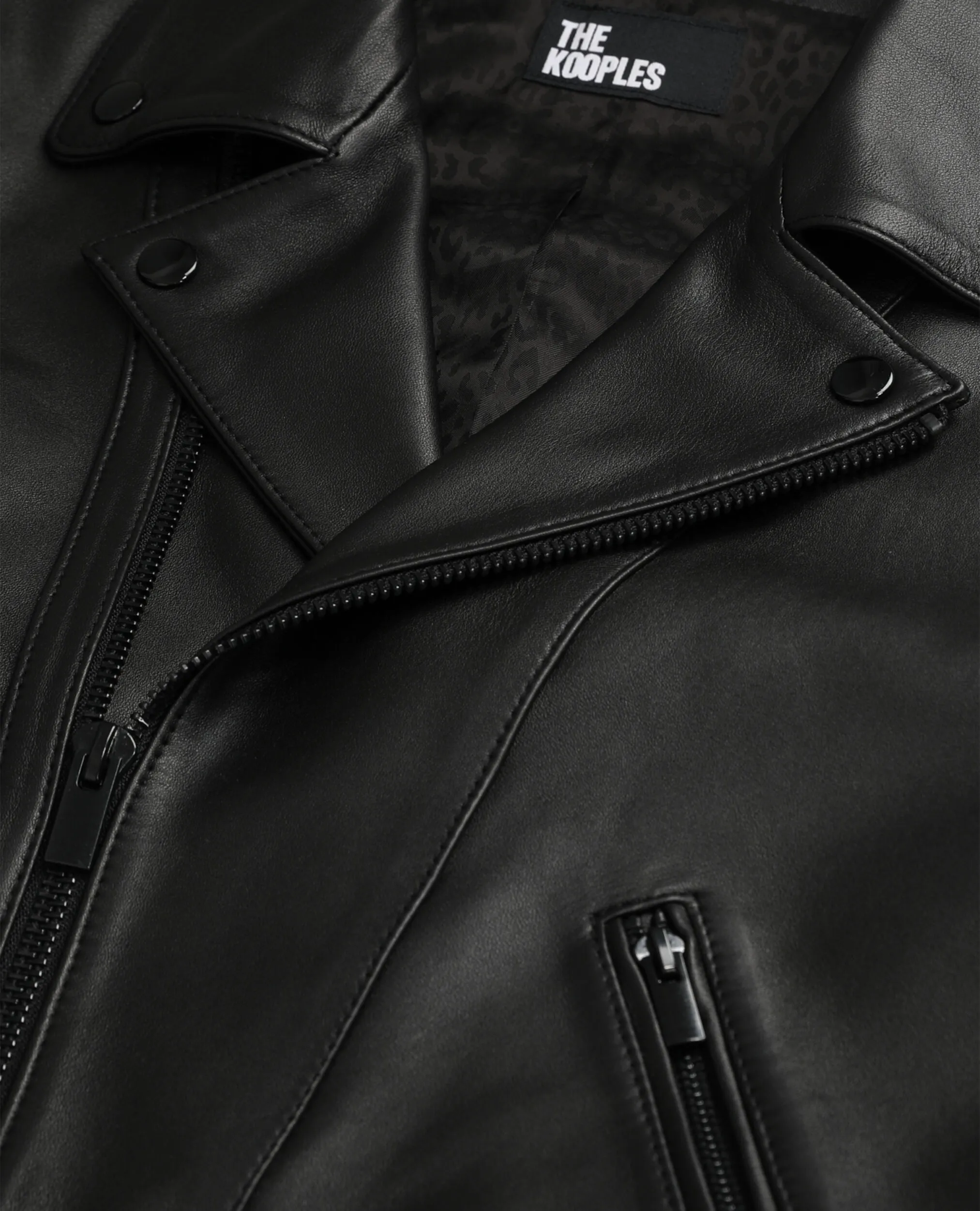 Black leather studded bomber jacket.