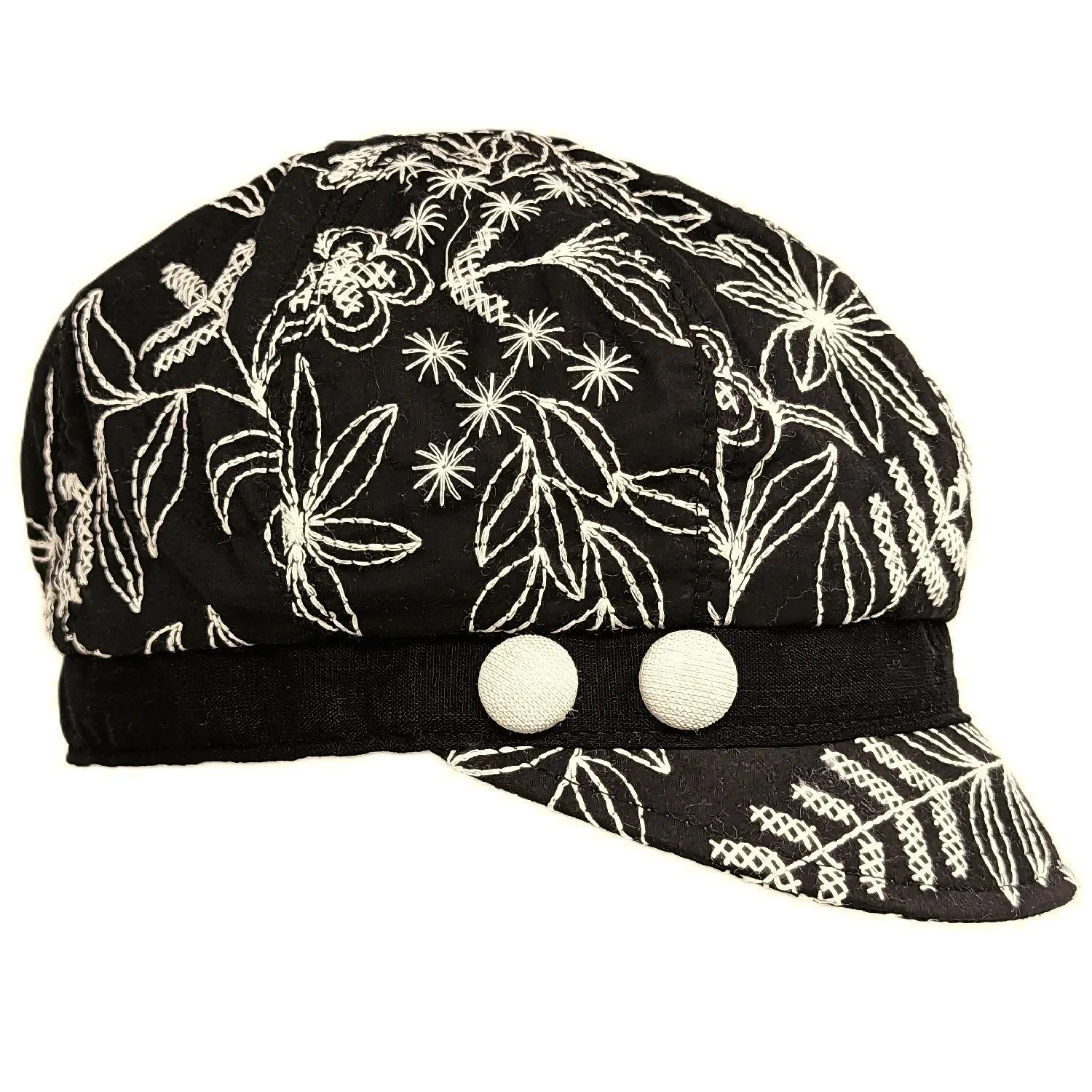 Cotton embroidered newsboy cap with buttons.