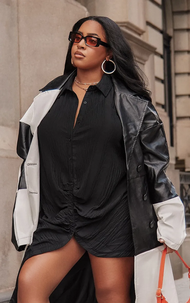 Black ruched front textured long sleeve shirt dress.